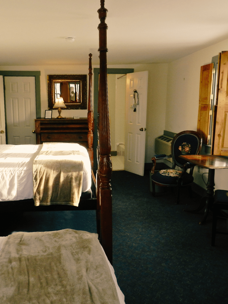 Two queen beds and a full bath in the Madison Room (Room 12) at The Historic Wayside Inn 1797 in Middletown, VA.