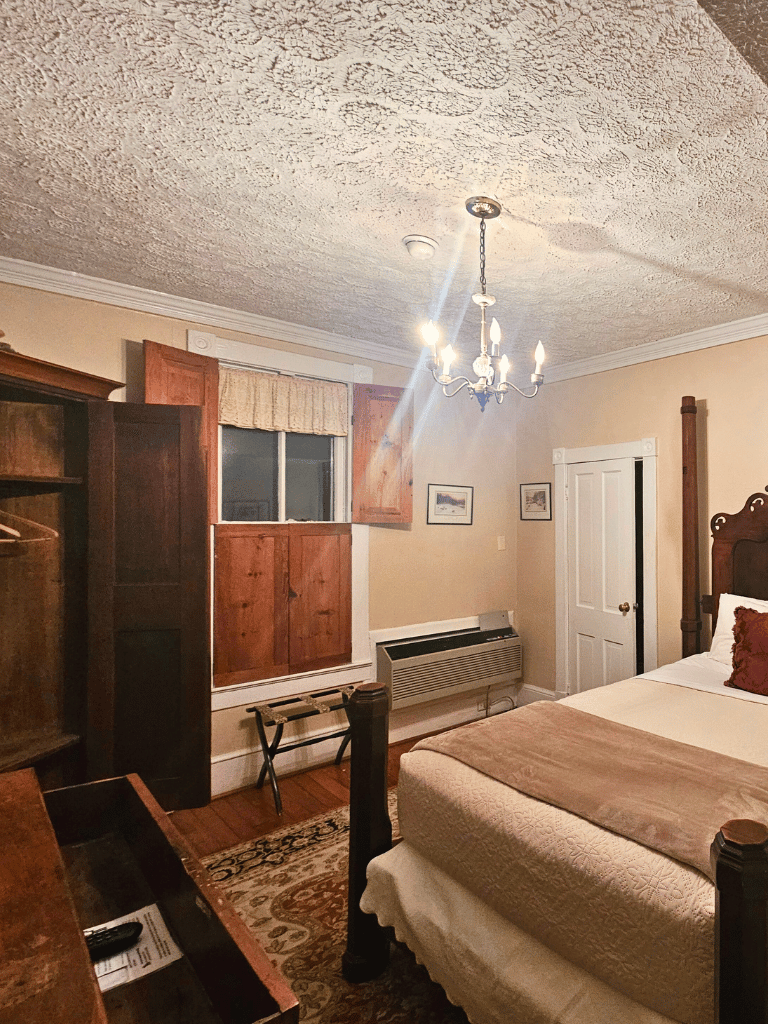 The Massanutten Room (Room 19) at The Historic Wayside Inn 1797, featuring a classic double bed and a private full bath in Middletown, VA.