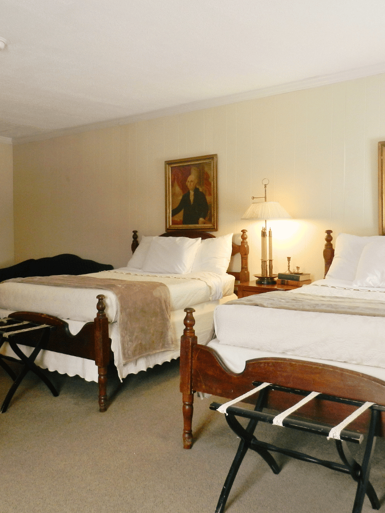 Two double beds in the Washington State Room (Room 16) at The Historic Wayside Inn 1797, Middletown, VA, featuring historic decor and a full private bath.